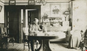 D.C. Patterson Sr. at the dinning room table, [1912] thumbnail