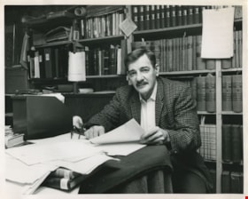 Man working at his desk, ca.1980 thumbnail
