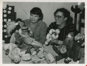 People playing with dolls, ca.1980 thumbnail