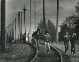 People walking on the railroad tracks, 1983 thumbnail