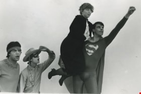 Man dressed up as Superman with unidentified women and two other men, ca.1983 thumbnail