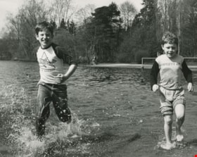 Two boys running in the lake, ca.1983 thumbnail