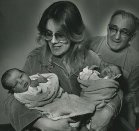 Woman and a man with two newborn babies, ca.1983 thumbnail