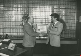 Unidentified man receiving an award, ca.1983 thumbnail