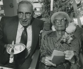 Elderly couple eating cake, ca.1983 thumbnail
