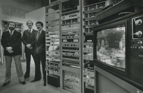 Three men near audio equipment, ca.1983 thumbnail