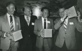 A group of unidentified men holding boxes, ca.1983 thumbnail