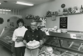 A man and woman in a deli/bakery, ca. 1982 thumbnail