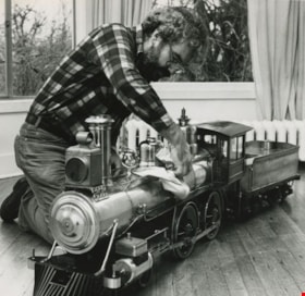 Man cleaning his model train, [1982] thumbnail