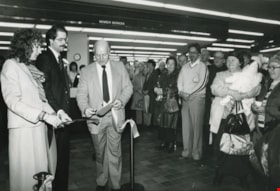 A man cutting the tape at an opening ceremony, ca.1982 thumbnail