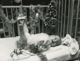 Unidentified baby at the hospital with two injured legs, ca.1982 thumbnail