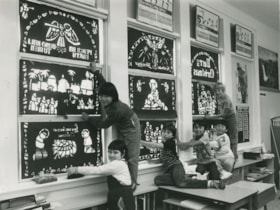 Children in a classroom hanging Christmas decorations, [1982] thumbnail