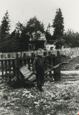Boy standing at the fence, [1920] (date of original), copied 1986 thumbnail