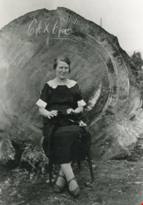 Annie Eshelby in front of a felled tree, 1924 thumbnail