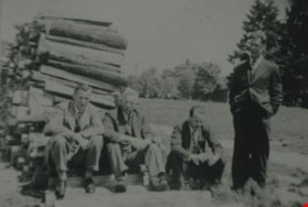 Teachers next to a woodpile, [between 1930 and 1949] thumbnail