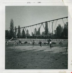 Kindergarters playing on the swings, July 1961 thumbnail