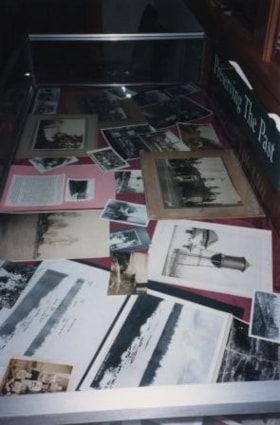 Photographs in a display case, 1990 thumbnail