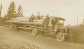 Ed Brown sitting on his transfer truck, [1920] thumbnail