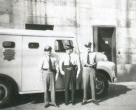 Loomis trucks and staff members, [195-] (date of original), copied 1992 thumbnail
