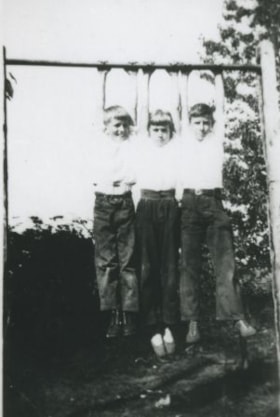 Children playing on a high bar, [1929] (date of original), copied 1992 thumbnail