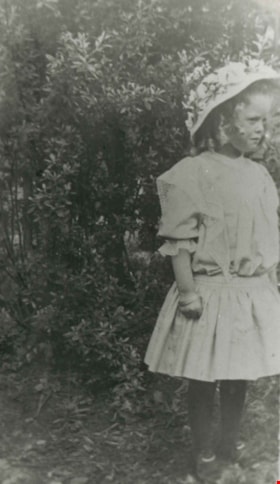 Little girl in a garden, 1912 (date of original), copied [1997] thumbnail
