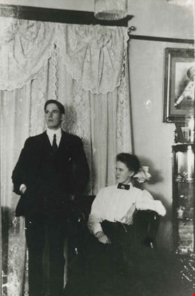 Man and woman in a living room, 1912 (date of original), copied [1997] thumbnail