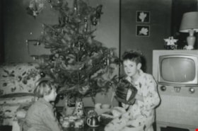 Janet and Cliff Anderson on Christmas morning, December 25, 1955 (date of original), copied 1991 thumbnail