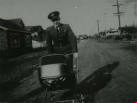 Eddie Manning with a baby carriage, [1943] (date of original), copied 1991 thumbnail
