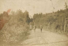 Men walking down a road, [1900] thumbnail