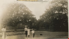 Woman and children in garden, 1940 thumbnail