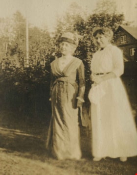 Women standing in a garden, [1910] thumbnail