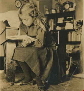 Kitty Hill reading a book, [1910] thumbnail