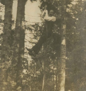 Man swinging on a rope swing, [1910] thumbnail