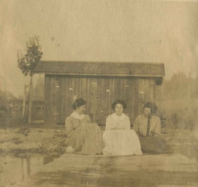 Women sitting in front of a boathouse, [1910] thumbnail