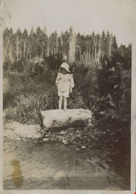 Kitty Hill standing on a log, [1903] thumbnail