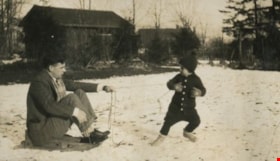 Robert pulling Bob on a sled, [1929] thumbnail