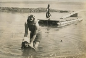 Kitty helping Robert swim, [1930] thumbnail