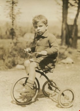Robert riding a tricycle, [1930] thumbnail