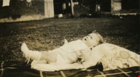 Ian Freebairn-Smith laying on a blanket, [1930] thumbnail