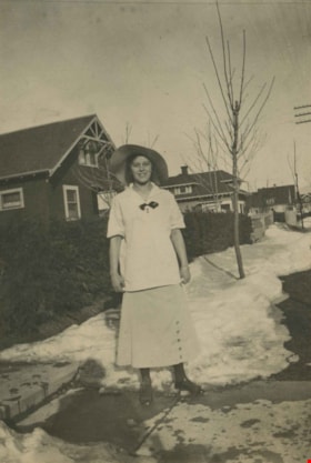 Girl standing in the snow, 1915 thumbnail