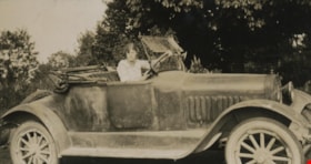 Woman seated in car, [1920] thumbnail