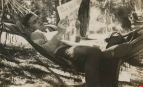 Bob Peers reading a newspaper, [1922] thumbnail
