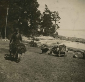 Claude Hill pushing a wheelbarrow, 1922 thumbnail