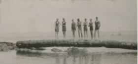 Group standing on a floating log, 1922 thumbnail