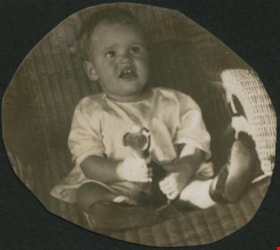 Child holding a toy, [1921] thumbnail