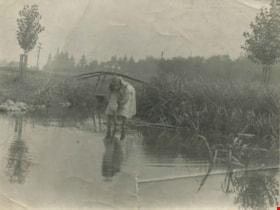 Kitty Hill wading in Deer Lake, 1910 thumbnail
