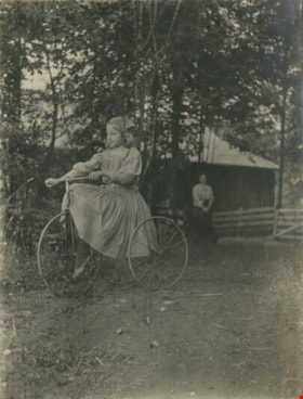 Kitty Riding a Bike, 1910 thumbnail