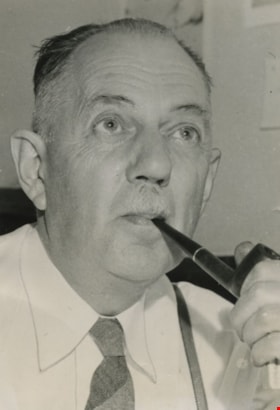 Charles B. Brown smoking a pipe, 1953, published January 4, 1959 thumbnail