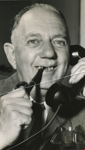 Charles B. Brown on the phone, [between 1954 to 1959] thumbnail