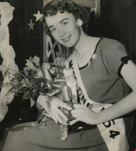 Nancy Hansen holding her winnings, 1954, published September 1, 1954 thumbnail
